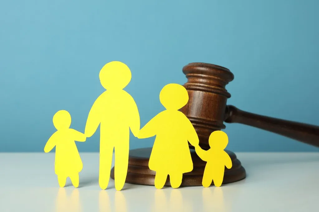 An image of a family law concept, white table and a wooden gavel