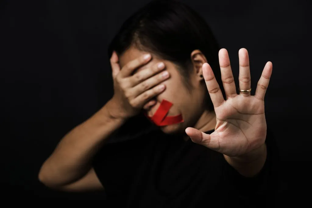 An image of aa woman blindfold her eyes wrapping also her mouth